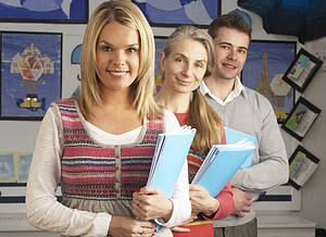 Portrait Of Group Of Teachers In Classroom