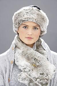 Studio Portrait Of Young Woman Wearing Fur Hat And Wrap