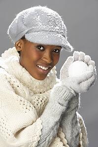 Fashionable Woman Wearing Knitwear And Cap In Studio