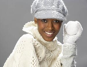 Fashionable Woman Wearing Knitwear And Cap In Studio