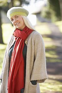 Portrait Of Woman Outdoors In Autumn Landscape