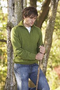 Young Man Outdoors Walking In Autumn Woodland Holding Walking Stick
