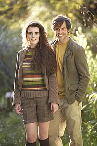 Portrait Of Romantic Young Couple In Autumn Landscape