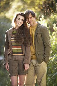 Portrait Of Romantic Young Couple In Autumn Landscape