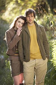 Portrait Of Romantic Young Couple In Autumn Landscape