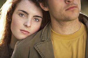 Portrait Of Romantic Young Couple In Autumn Landscape