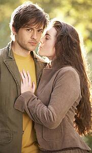 Portrait Of Romantic Young Couple In Autumn Landscape