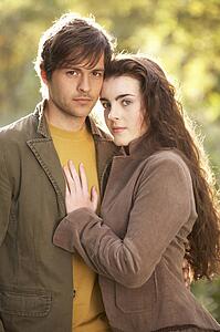 Portrait Of Romantic Young Couple In Autumn Landscape