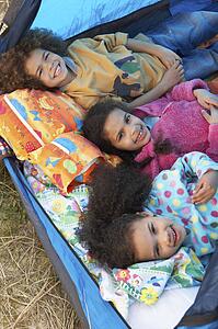 Children Having Fun Inside Tent On Camping Holiday