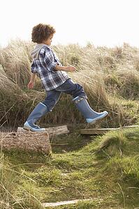 Young Boy Going For Walk In Wellington Boots