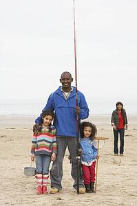 Family On Beach Fishing Trip