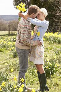 Romantic Couple Walking Amongst Spring Daffodils