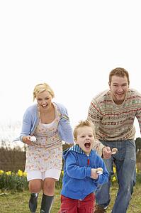 Family Having Egg And Spoon Race
