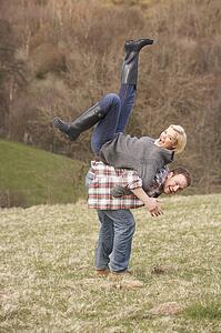 Portrait Of Energetic Young Couple Having Fun
