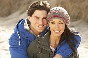 Romantic Young Couple On Winter Beach