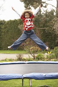 Boy Playing On Trampoline