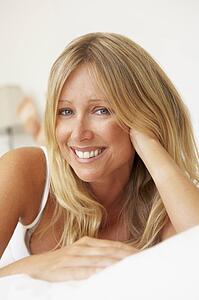 Young Woman Relaxing On Bed