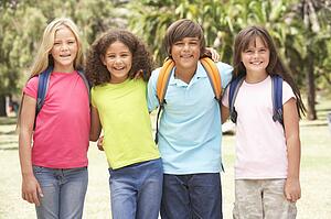 Group Of Schoolchildren Standing In Park
