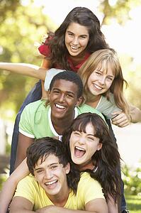 Group Of Teenagers Piled Up In Park