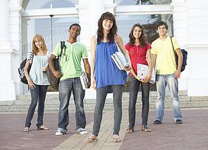 Group Of Teenage Students Standing Outside College Building