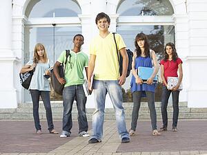 Group Of Teenage Students Standing Outside College Building