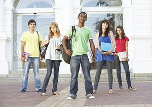 Group Of Teenage Students Standing Outside College Building
