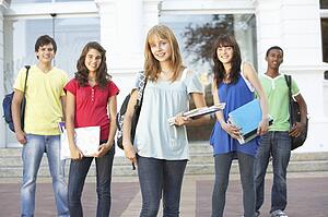 Group Of Teenage Students Standing Outside College Building