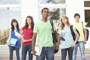 Group Of Teenage Students Standing Outside College Building