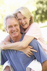 Portrait Of Romantic Senior Couple In Park
