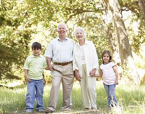 Grandparents In Park With Grandchildren