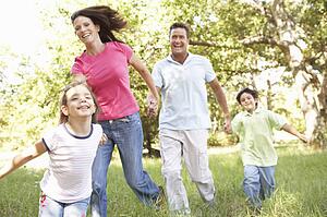 Family Enjoying Walk In Park