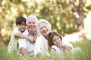 Grandparents In Park With Grandchildren