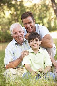 Grandfather With Son And Grandson In Park