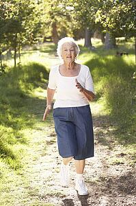Senior Woman Jogging In Park