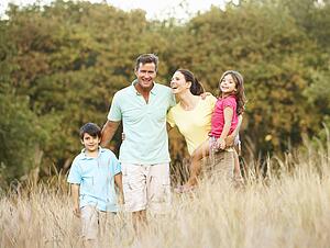 Family Enjoying Walk In Park