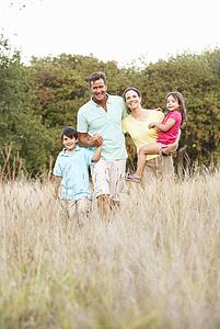 Family Enjoying Walk In Park