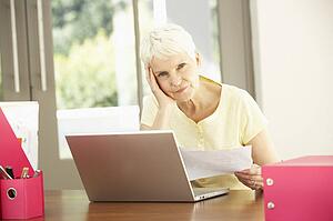 Senior Woman Using Laptop At Home