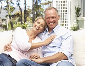 Couple Relaxing In Garden