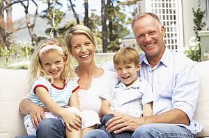 Family Relaxing In Garden