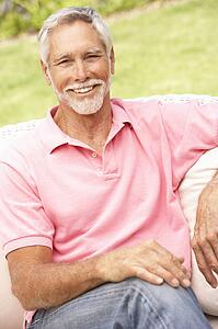 Senior Man Relaxing In Garden