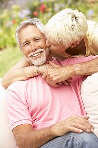 Senior Couple Relaxing In Garden