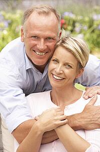 Couple Relaxing In Garden