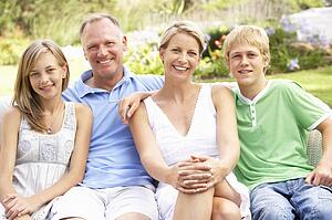 Family Relaxing In Garden