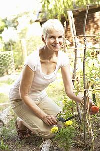 Senior Woman Relaxing In Garden