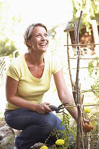 Woman Relaxing In Garden
