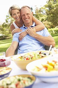 Couple Enjoying Meal In Garden