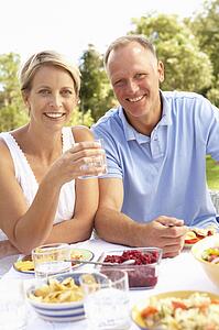 Couple Enjoying Meal In Garden