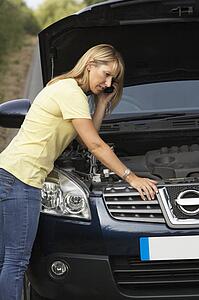 Female Driver Broken Down On Country Road