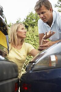 Man And Woman Having Argument After Traffic Accident