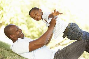 Portrait of Happy Father and Son In Park